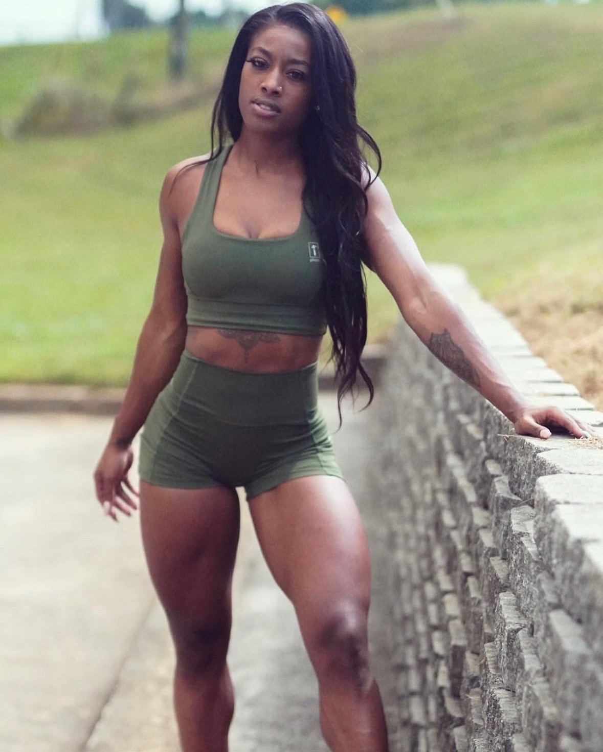 Ajiea in olive activewear outdoors